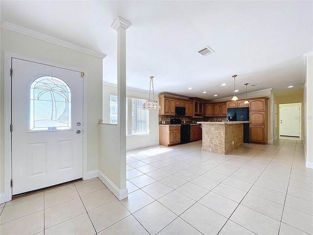 kitchen with tasteful backsplash, visible vents, ornamental molding, light tile patterned floors, and black appliances