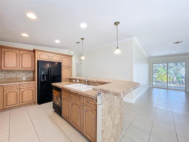 kitchen featuring visible vents, black appliances, a sink, tasteful backsplash, and light tile patterned flooring