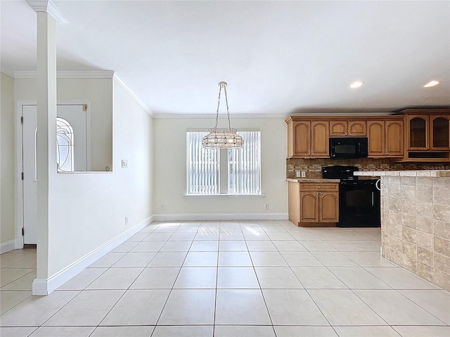 kitchen featuring light tile patterned floors, brown cabinetry, decorative backsplash, black appliances, and crown molding