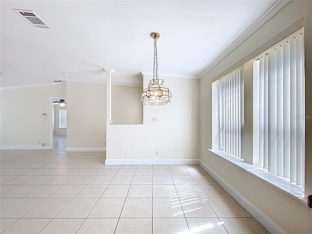 unfurnished room featuring a wealth of natural light, visible vents, ornamental molding, and light tile patterned floors