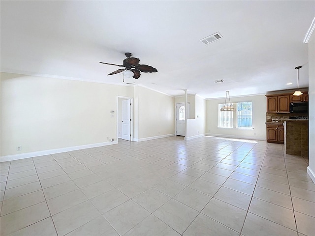 unfurnished living room featuring visible vents, ornamental molding, ceiling fan with notable chandelier, light tile patterned floors, and baseboards