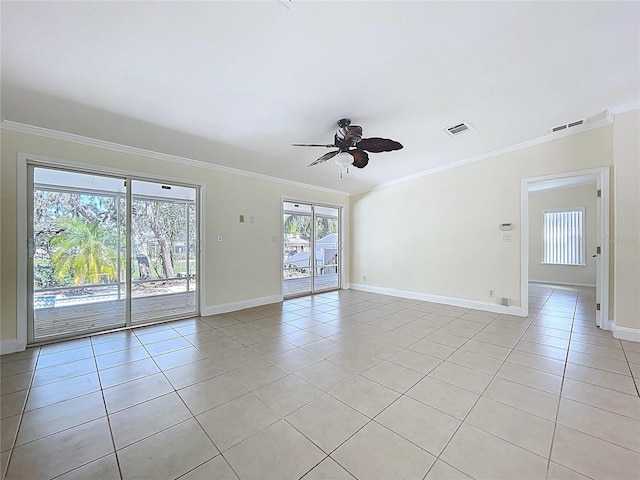 empty room with crown molding, light tile patterned floors, visible vents, and ceiling fan