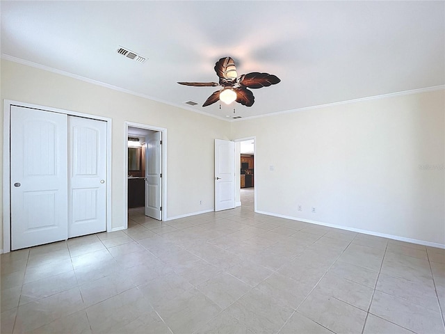 unfurnished bedroom with baseboards, visible vents, and ornamental molding