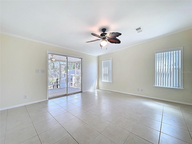 unfurnished room with light tile patterned floors, visible vents, ornamental molding, and a ceiling fan