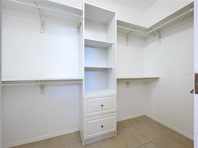 spacious closet featuring light tile patterned flooring