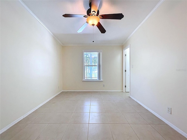 spare room featuring light tile patterned flooring, baseboards, ceiling fan, and ornamental molding