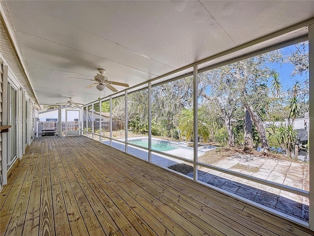 wooden terrace featuring an outdoor pool and ceiling fan