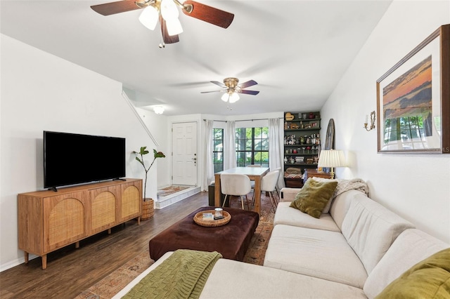 living area featuring dark wood finished floors and a ceiling fan