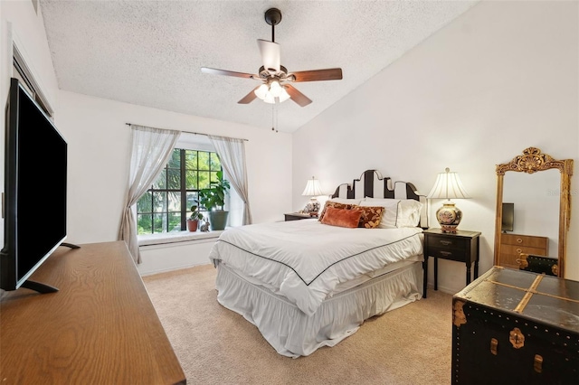 bedroom featuring light colored carpet, a textured ceiling, and lofted ceiling