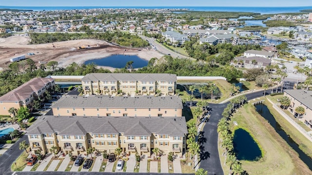 birds eye view of property featuring a residential view and a water view