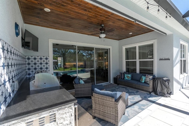 view of patio / terrace featuring an outdoor hangout area, ceiling fan, and exterior kitchen