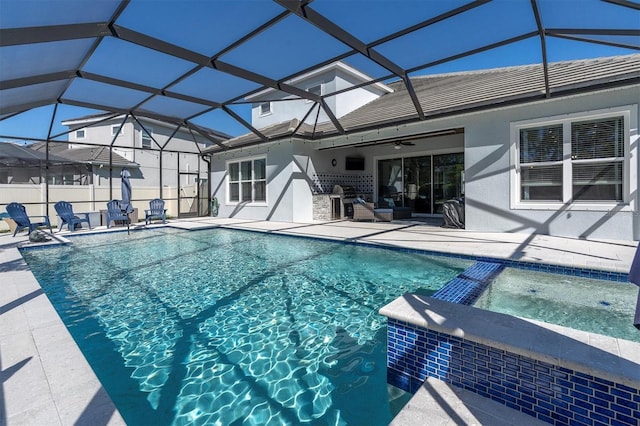 view of swimming pool with a lanai, ceiling fan, a pool with connected hot tub, and a patio