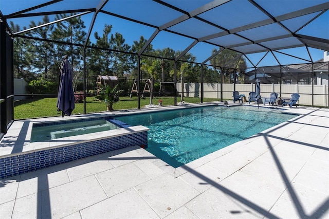 view of swimming pool featuring a lanai, a pool with connected hot tub, a fenced backyard, and a patio area