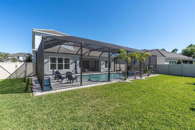 back of house with a patio, a fenced backyard, a yard, a fenced in pool, and a lanai