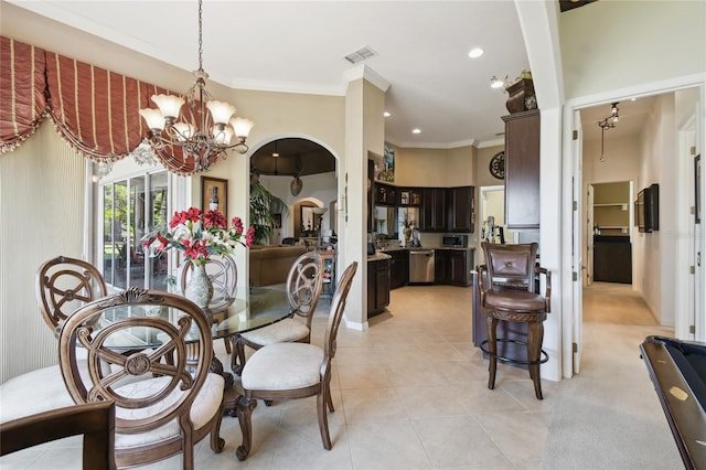 dining area featuring visible vents, light tile patterned flooring, arched walkways, ornamental molding, and a chandelier