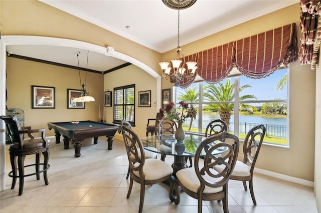 dining room with light tile patterned flooring, pool table, crown molding, and a water view