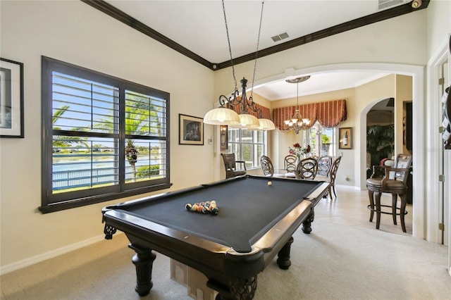 recreation room featuring arched walkways, visible vents, carpet flooring, and crown molding