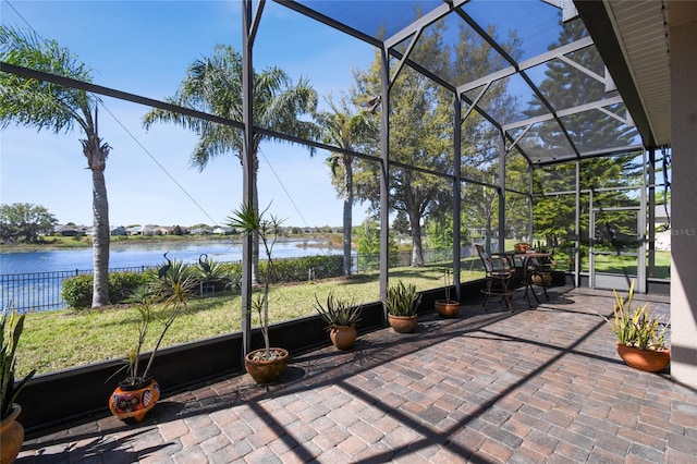 unfurnished sunroom with a water view