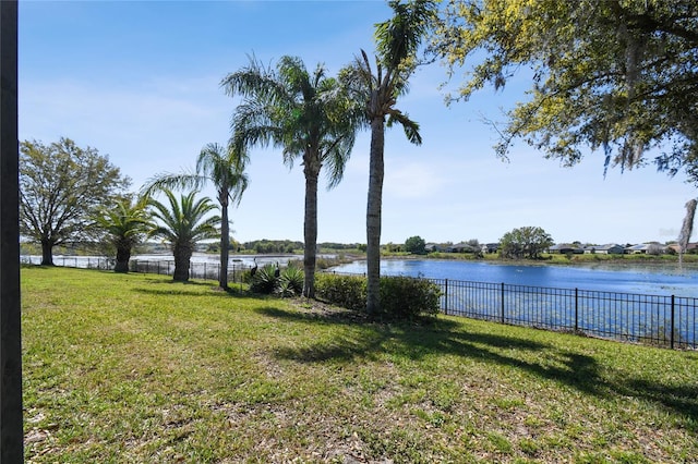 property view of water featuring fence