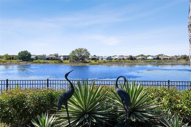 view of water feature with fence