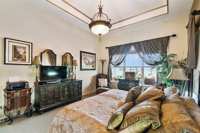 bedroom featuring baseboards and carpet floors