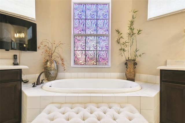 bathroom featuring vanity and a garden tub