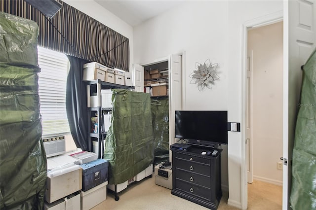 carpeted bedroom with cooling unit and baseboards