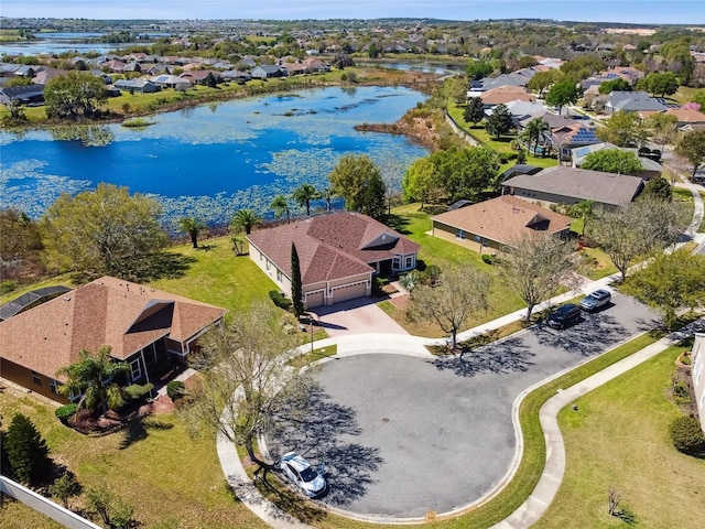 bird's eye view featuring a residential view and a water view