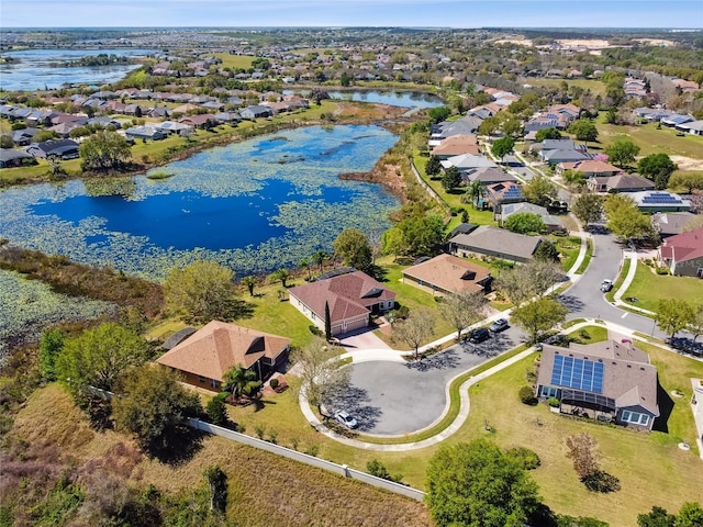 bird's eye view with a residential view and a water view