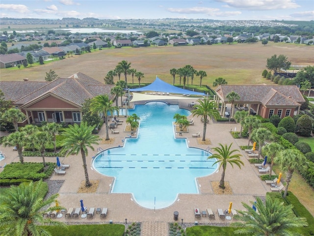 pool featuring a residential view and a patio