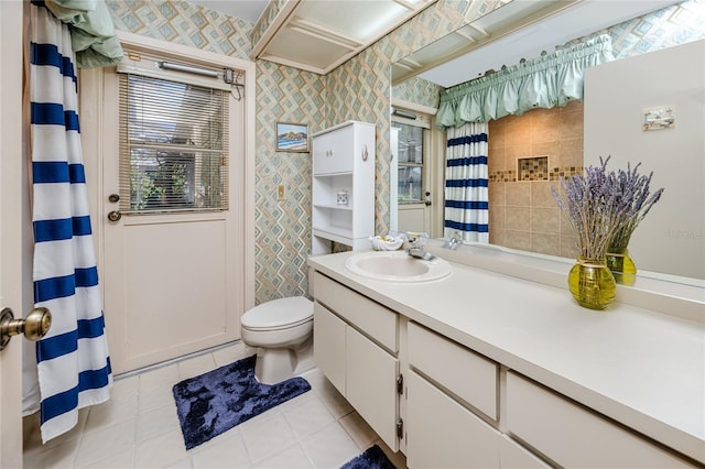 full bathroom with tile patterned floors, toilet, vanity, and wallpapered walls