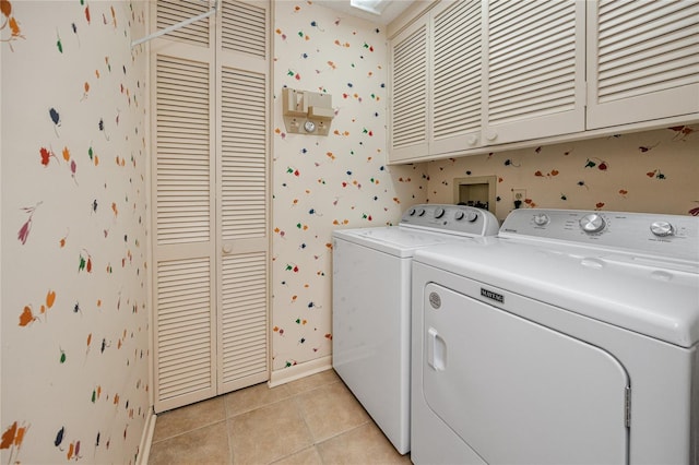 laundry area with cabinet space and wallpapered walls