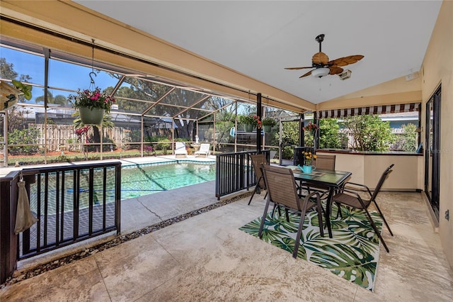 pool featuring glass enclosure, fence, ceiling fan, and a patio area