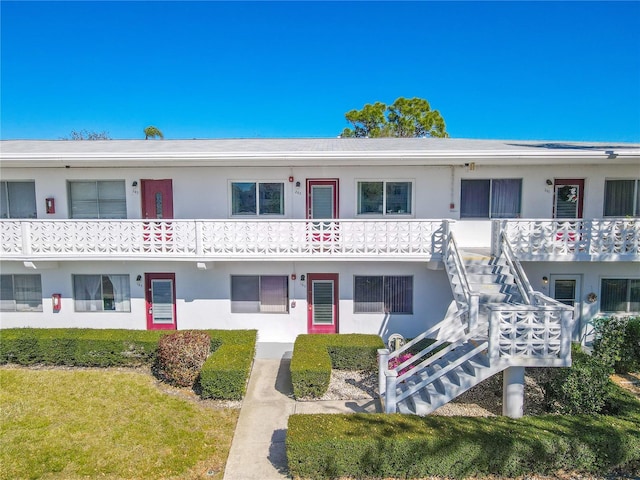 view of property featuring stairway