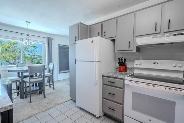 8325 112th St Unit 202, Seminole, FL 33772 - kitchen featuring under cabinet range hood, white appliances, light colored carpet, and gray cabinetry