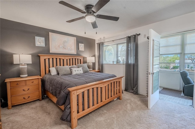 8325 112th St Unit 202, Seminole, FL 33772 - bedroom featuring multiple windows, ceiling fan, and carpet flooring