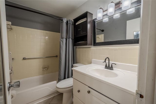 8325 112th St Unit 202, Seminole, FL 33772 - bathroom featuring tile patterned floors, toilet, tile walls, shower / tub combo, and vanity