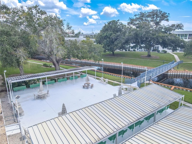 8325 112th St Unit 202, Seminole, FL 33772 - dock area with a yard, outdoor dining space, and a patio
