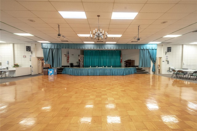 8325 112th St Unit 202, Seminole, FL 33772 - miscellaneous room with a drop ceiling and an inviting chandelier