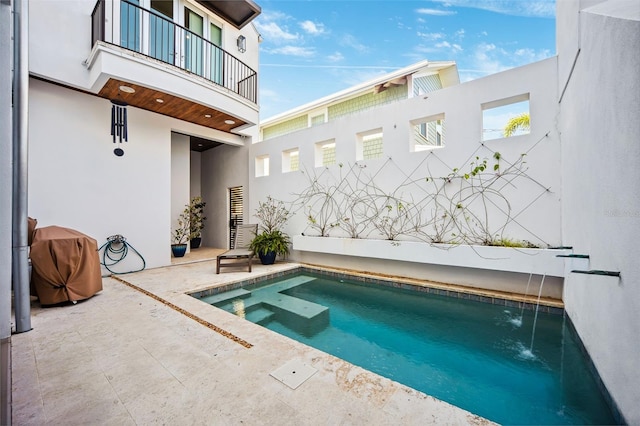 view of pool featuring a patio