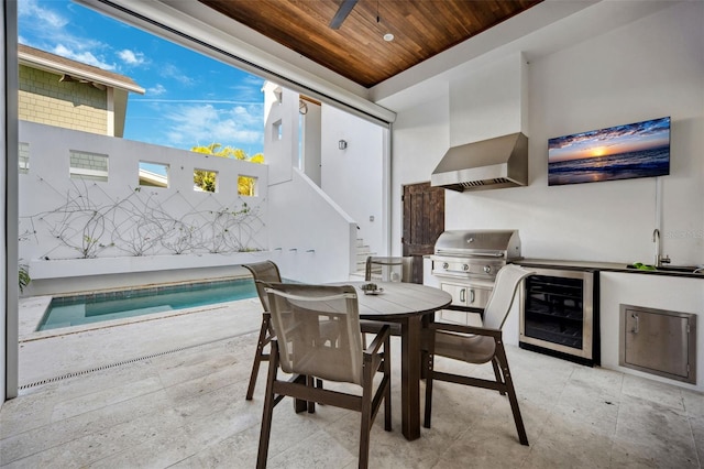 dining room featuring beverage cooler, wooden ceiling, and stairs