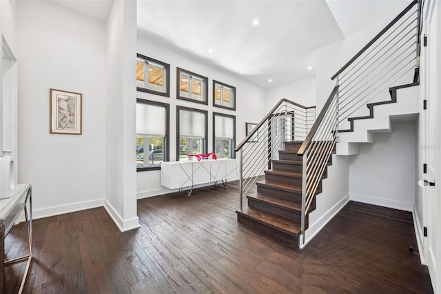 foyer entrance featuring recessed lighting, stairs, baseboards, and hardwood / wood-style flooring