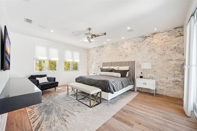 bedroom with recessed lighting, visible vents, wood finished floors, and ceiling fan