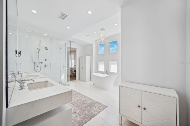 full bathroom with visible vents, a soaking tub, recessed lighting, a sink, and a shower stall