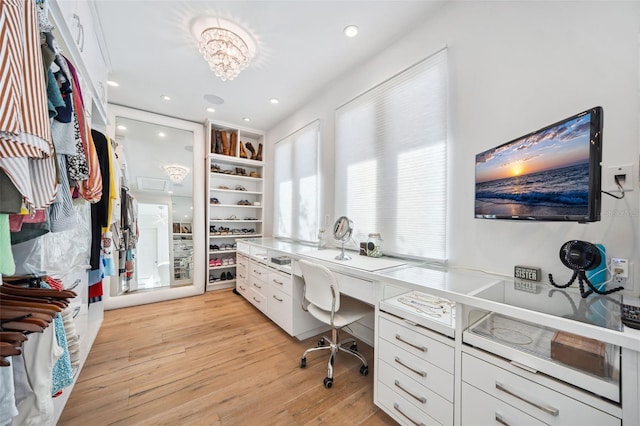 office with a notable chandelier, recessed lighting, and light wood-type flooring