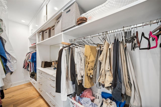 walk in closet featuring light wood finished floors