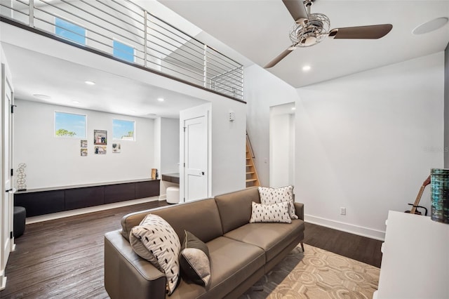 living room with wood finished floors, recessed lighting, stairway, baseboards, and ceiling fan