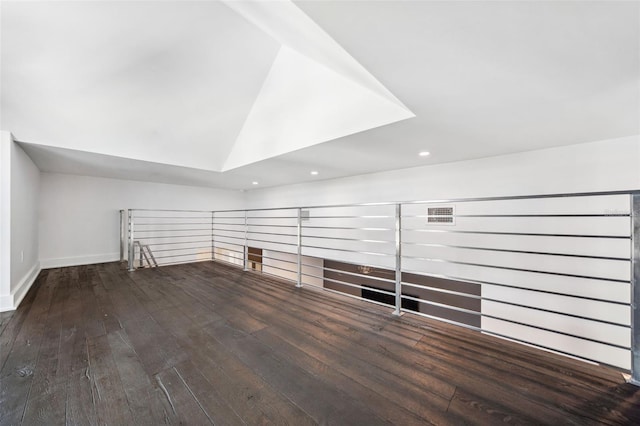 additional living space featuring recessed lighting, baseboards, lofted ceiling, and hardwood / wood-style flooring