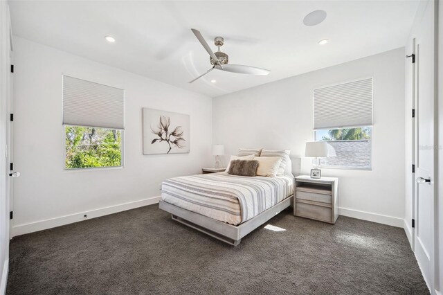 bedroom with recessed lighting, dark colored carpet, baseboards, and ceiling fan