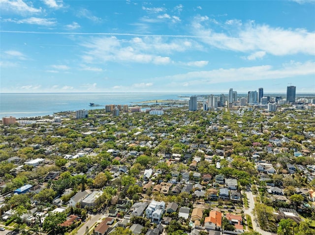 drone / aerial view featuring a water view and a city view